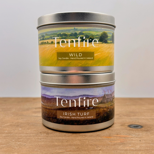 two candle tins sitting on top of each other branded with Tenfire