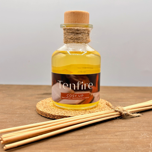 glass bottle reed diffuser with rattan reeds and a cork pad to sit on